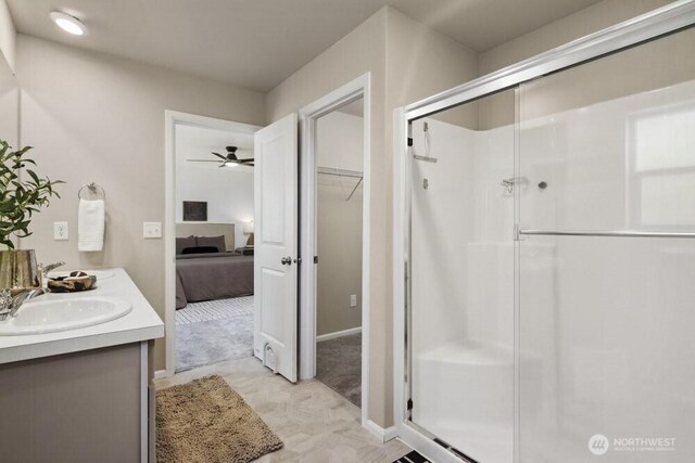 1709 Fern St SW, Olympia, WA 98502 - bathroom featuring a shower stall, double vanity, ensuite bathroom, and a ceiling fan