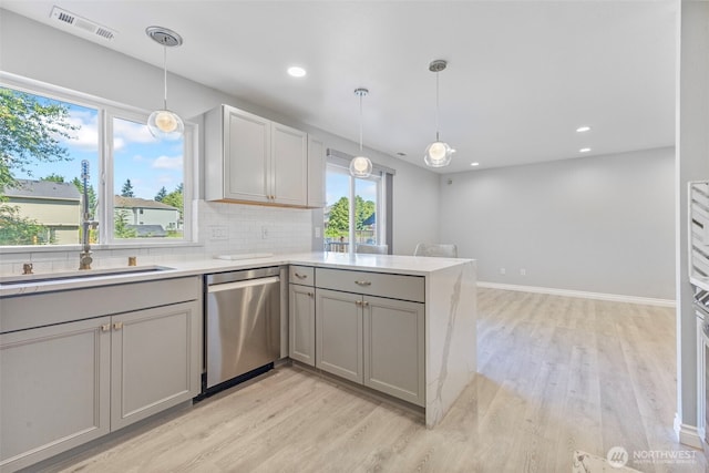 20602 86th Avenue Ct E, Spanaway, WA 98387 - kitchen with dishwasher, gray cabinets, light wood-style floors, a peninsula, and recessed lighting