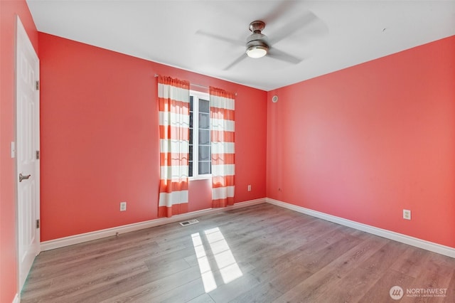 20602 86th Avenue Ct E, Spanaway, WA 98387 - empty room with wood finished floors, a ceiling fan, and baseboards