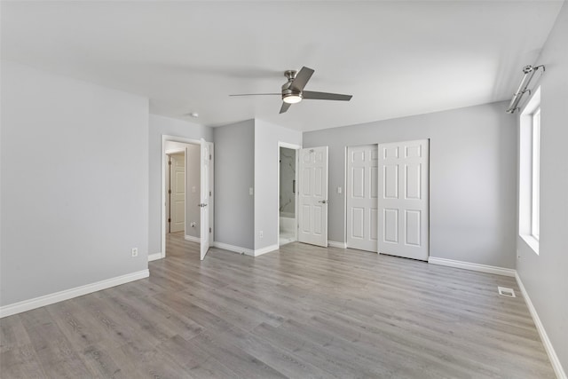 20602 86th Avenue Ct E, Spanaway, WA 98387 - unfurnished bedroom with baseboards, wood finished floors, and a closet