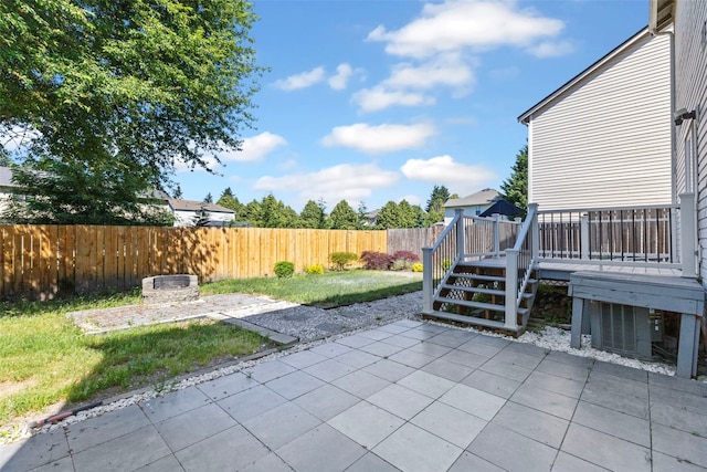 20602 86th Avenue Ct E, Spanaway, WA 98387 - fenced backyard featuring a patio and a wooden deck