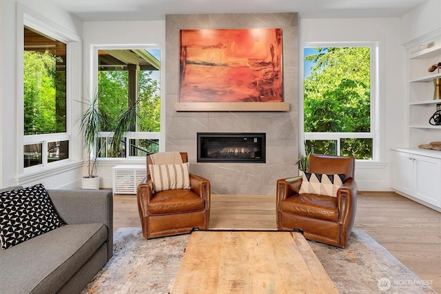 14430 SE 18th St, Bellevue, WA 98007 - living room featuring wood finished floors and a fireplace