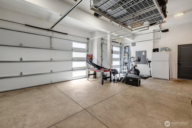 14430 SE 18th St, Bellevue, WA 98007 - garage featuring freestanding refrigerator, a heating unit, and electric panel