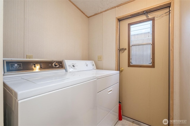 316 W Lake Samish Dr Unit 10, Bellingham, WA 98229 - washroom with washer and clothes dryer and ornamental molding