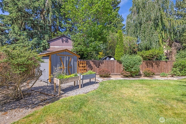 6218 199th Street Ct E, Spanaway, WA 98387 - fenced backyard featuring a storage unit