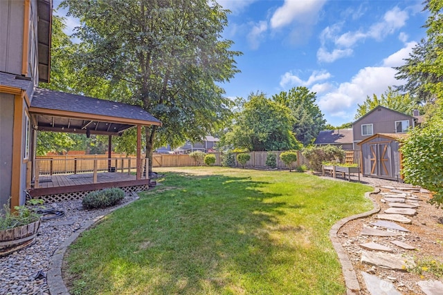 6218 199th Street Ct E, Spanaway, WA 98387 - fenced backyard with a shed and a wooden deck