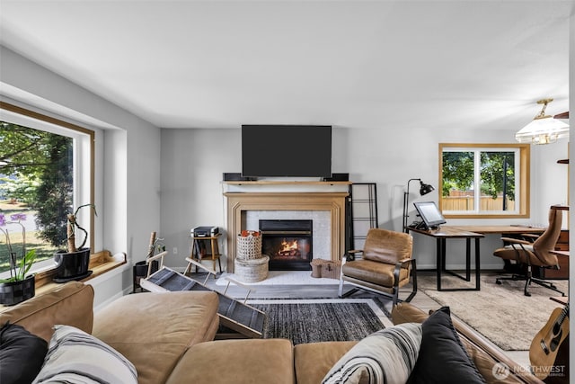 6218 199th Street Ct E, Spanaway, WA 98387 - living area featuring a tiled fireplace and baseboards