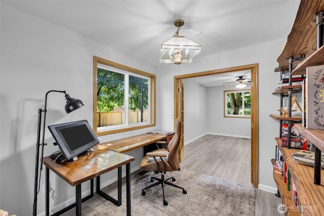 6218 199th Street Ct E, Spanaway, WA 98387 - home office featuring wood finished floors, a chandelier, and a ceiling fan