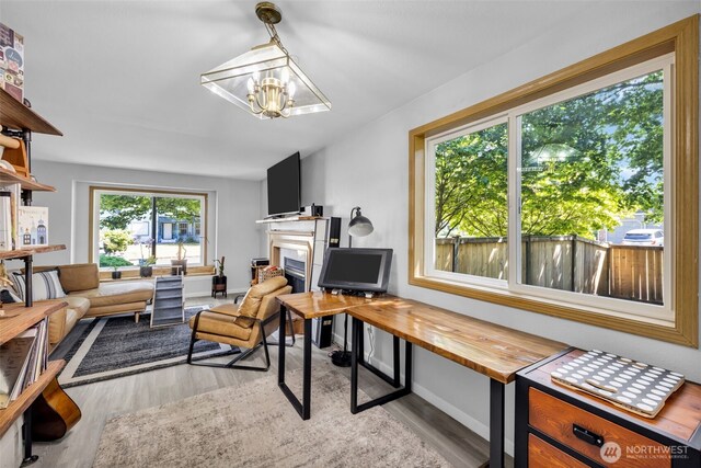 6218 199th Street Ct E, Spanaway, WA 98387 - living area with a chandelier, a fireplace, and wood finished floors