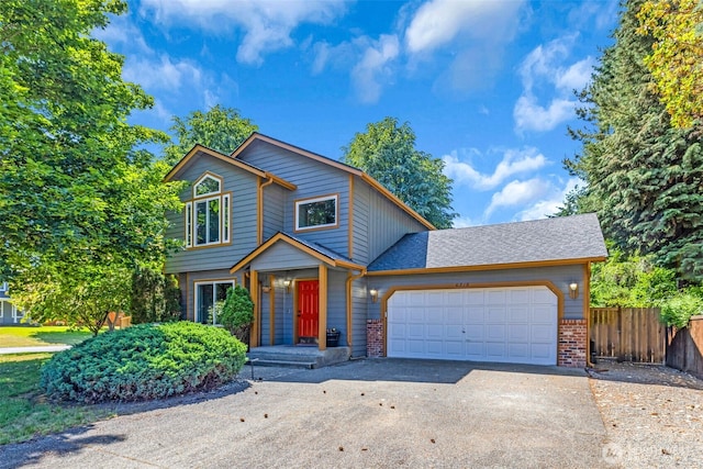 6218 199th Street Ct E, Spanaway, WA 98387 - view of front of home featuring driveway, an attached garage, and brick siding