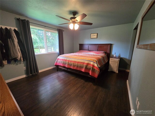 4776 Prairie Ln, Sedro Woolley, WA 98284 - bedroom featuring baseboards, dark wood finished floors, and ceiling fan