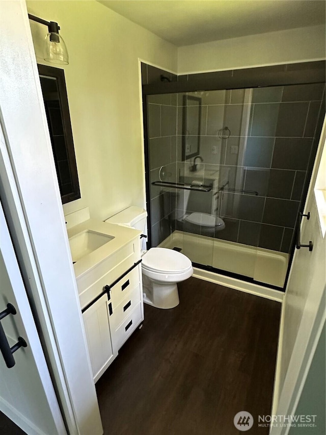 4776 Prairie Ln, Sedro Woolley, WA 98284 - bathroom with toilet, wood finished floors, vanity, and a shower stall
