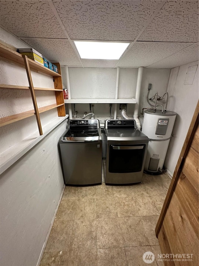 4776 Prairie Ln, Sedro Woolley, WA 98284 - laundry area featuring water heater, washing machine and clothes dryer, and baseboards