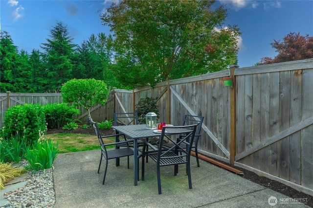 6412 122nd Street Ct E, Puyallup, WA 98373 - fenced backyard featuring a patio area and outdoor dining area