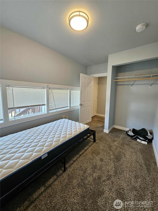 903 W Franklin St, Shelton, WA 98584 - bedroom featuring a closet and dark carpet