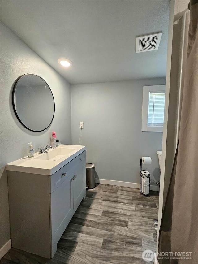 903 W Franklin St, Shelton, WA 98584 - bathroom featuring vanity, wood finished floors, and recessed lighting
