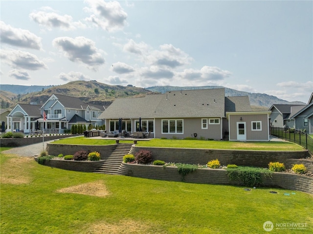 167 N Shore Dr, Orondo, WA 98843 - back of house featuring a mountain view and a residential view