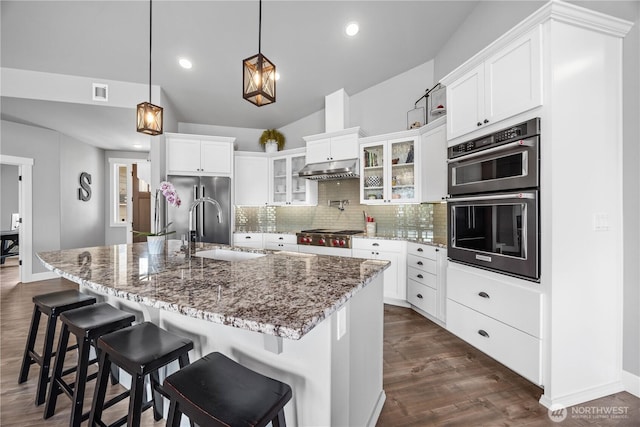 167 N Shore Dr, Orondo, WA 98843 - kitchen featuring stainless steel appliances, backsplash, dark wood-style floors, white cabinets, and recessed lighting