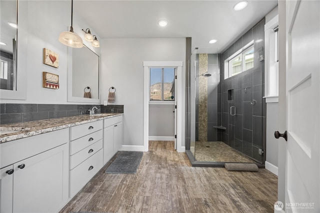 167 N Shore Dr, Orondo, WA 98843 - bathroom with vanity, a stall shower, wood finished floors, and recessed lighting