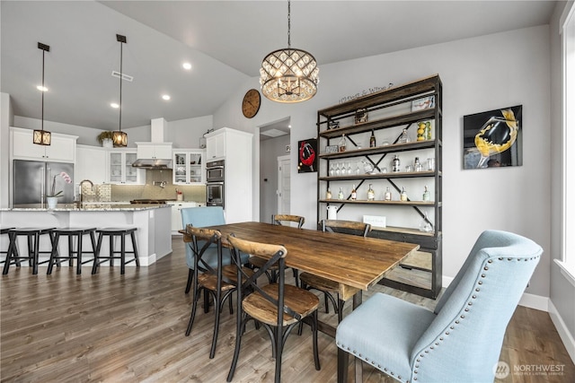 167 N Shore Dr, Orondo, WA 98843 - dining area with lofted ceiling, dark wood-style floors, a chandelier, and recessed lighting