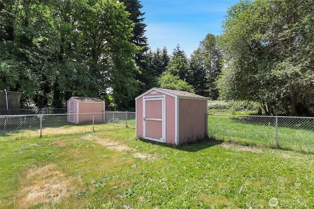 643 School St SE, Lacey, WA 98503 - fenced backyard featuring a storage shed