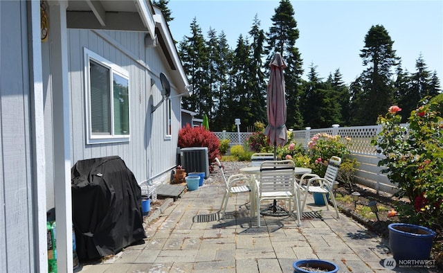 20 Brett Cir, Sequim, WA 98382 - fenced backyard featuring a patio, outdoor dining space, and a grill