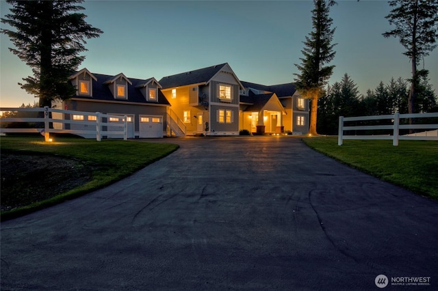 30 Chauncey Ln W, Pacific Beach, WA 98571 - view of front of house featuring asphalt driveway and a garage