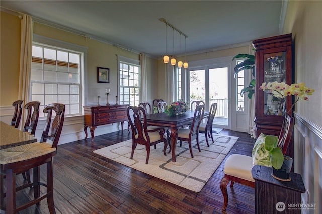 30 Chauncey Ln W, Pacific Beach, WA 98571 - dining room with ornamental molding, dark wood finished floors, a wainscoted wall, and a decorative wall