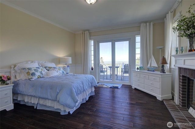 30 Chauncey Ln W, Pacific Beach, WA 98571 - bedroom with dark wood-style flooring, access to exterior, wainscoting, a fireplace, and ornamental molding