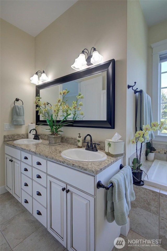 30 Chauncey Ln W, Pacific Beach, WA 98571 - bathroom featuring double vanity, a bathtub, and tile patterned flooring