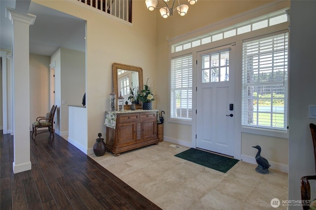 30 Chauncey Ln W, Pacific Beach, WA 98571 - foyer entrance featuring plenty of natural light, a chandelier, and wood finished floors