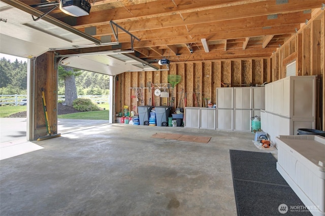 30 Chauncey Ln W, Pacific Beach, WA 98571 - garage featuring a garage door opener