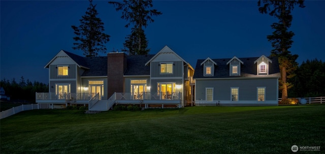 30 Chauncey Ln W, Pacific Beach, WA 98571 - back of house at twilight featuring a deck