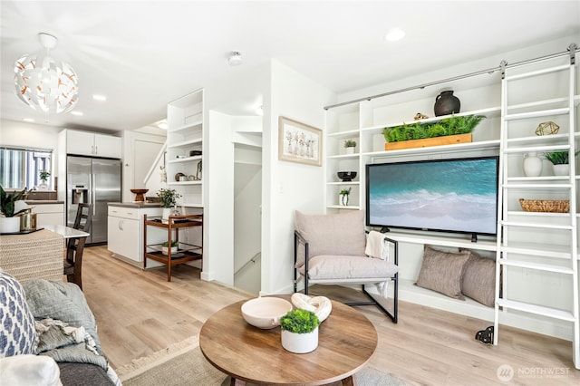 4795 35th Ave S Unit B, Seattle, WA 98118 - living area with light wood-type flooring, a chandelier, and recessed lighting