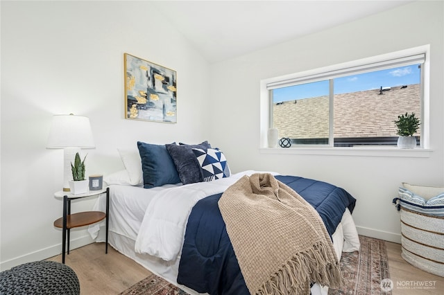 4795 35th Ave S Unit B, Seattle, WA 98118 - bedroom featuring wood finished floors and vaulted ceiling