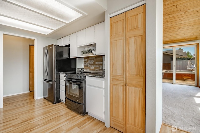 8380 Grouse Crescent Dr, Blaine, WA 98230 - kitchen with black / electric stove, open shelves, white cabinetry, decorative backsplash, and freestanding refrigerator
