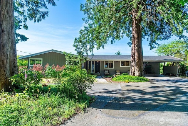 21424 Calhoun Rd, Monroe, WA 98272 - ranch-style home with driveway and an attached carport