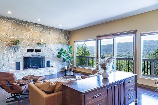 21424 Calhoun Rd, Monroe, WA 98272 - living area with a stone fireplace, wood finished floors, and recessed lighting