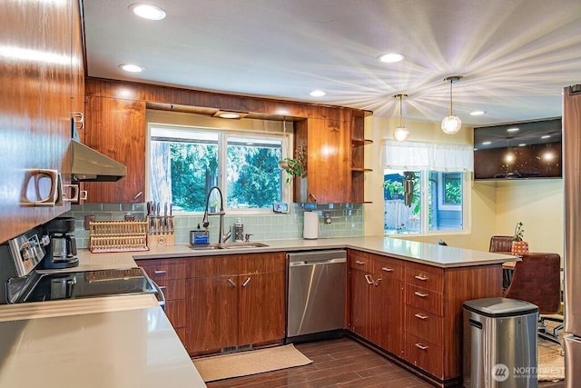21424 Calhoun Rd, Monroe, WA 98272 - kitchen featuring stainless steel dishwasher, under cabinet range hood, a peninsula, range with electric stovetop, and light countertops