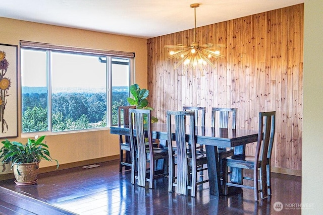 21424 Calhoun Rd, Monroe, WA 98272 - dining room with wooden walls, a chandelier, and wood finished floors