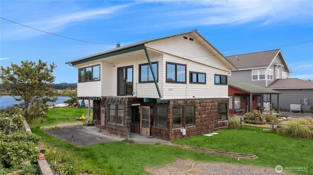 2403 Sunlight Beach Rd, Clinton, WA 98236 - rear view of property with a lawn and a patio