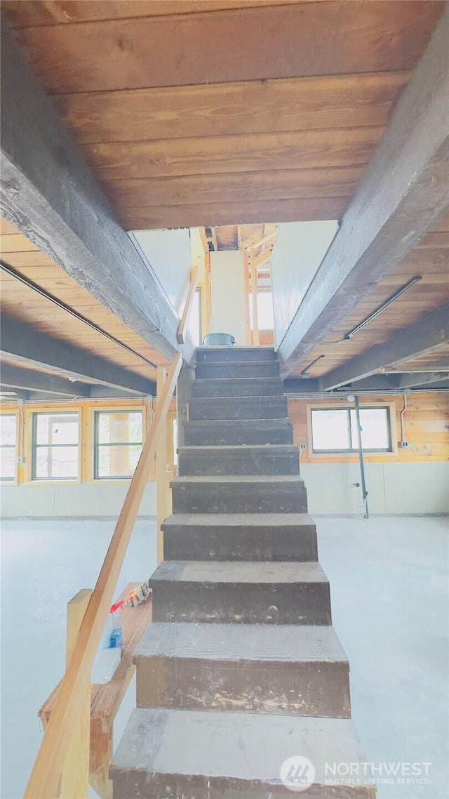 2403 Sunlight Beach Rd, Clinton, WA 98236 - stairway featuring wood ceiling, plenty of natural light, and concrete flooring