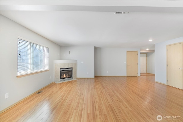 3929 152nd Pl SE, Bothell, WA 98012 - unfurnished living room featuring light wood finished floors, a fireplace, and recessed lighting