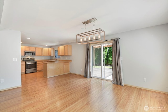 3929 152nd Pl SE, Bothell, WA 98012 - kitchen featuring appliances with stainless steel finishes, light brown cabinetry, light wood-style flooring, light countertops, and recessed lighting