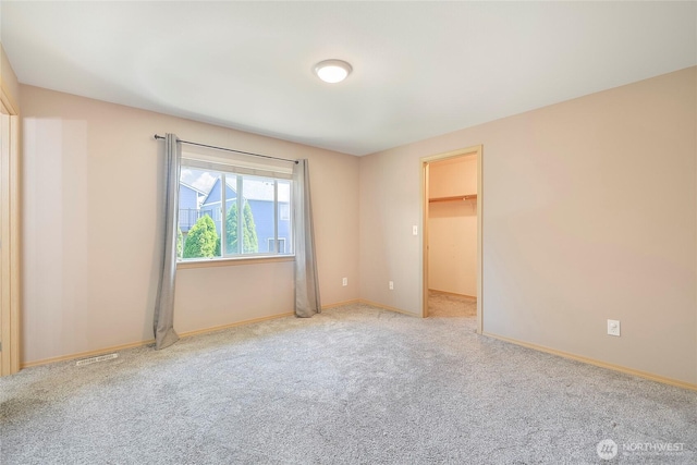 3929 152nd Pl SE, Bothell, WA 98012 - unfurnished bedroom with carpet and a walk in closet