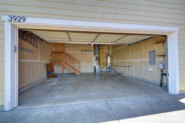 3929 152nd Pl SE, Bothell, WA 98012 - garage featuring electric panel, water heater, and concrete driveway