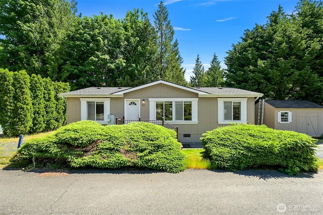 2174 Yew Street Rd Unit 22, Bellingham, WA 98229 - view of front of property featuring a storage shed, crawl space, and a shingled roof