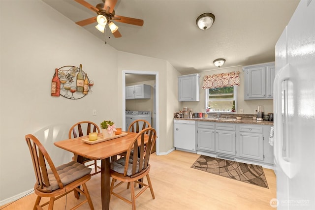 2174 Yew Street Rd Unit 22, Bellingham, WA 98229 - dining space featuring separate washer and dryer, lofted ceiling, light wood-style flooring, and a ceiling fan