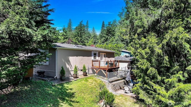 2174 Yew Street Rd Unit 22, Bellingham, WA 98229 - rear view of property with a wooden deck and a lawn