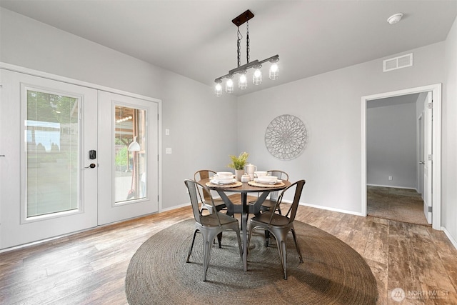 3664 N Red River Rd, Ferndale, WA 98248 - dining area featuring wood finished floors and french doors